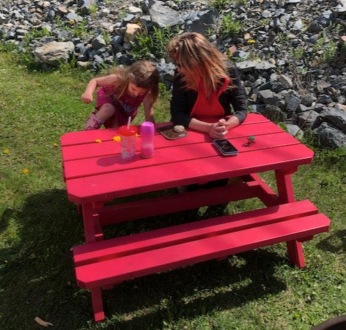 Kids picnic table being used from our Kids picnic table woodworking plan